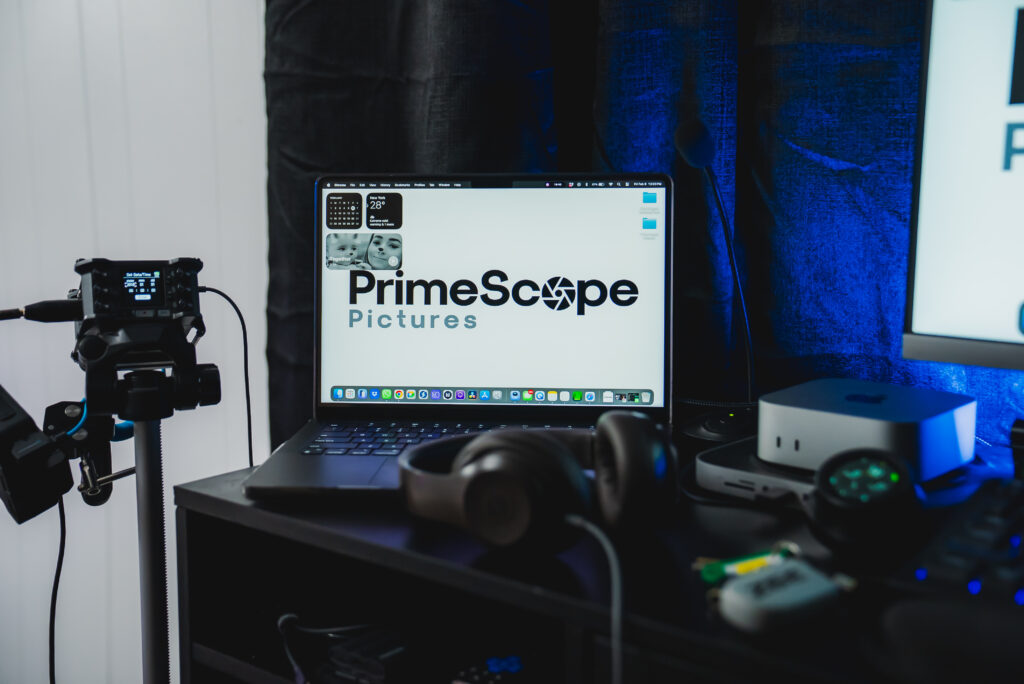 In-studio editing setup with multiple monitors, computer, editing software, and professional lighting for content creation.