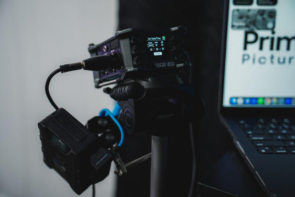 Modern photography studio with professional lighting, backdrops, cameras, and equipment arranged for a shoot.